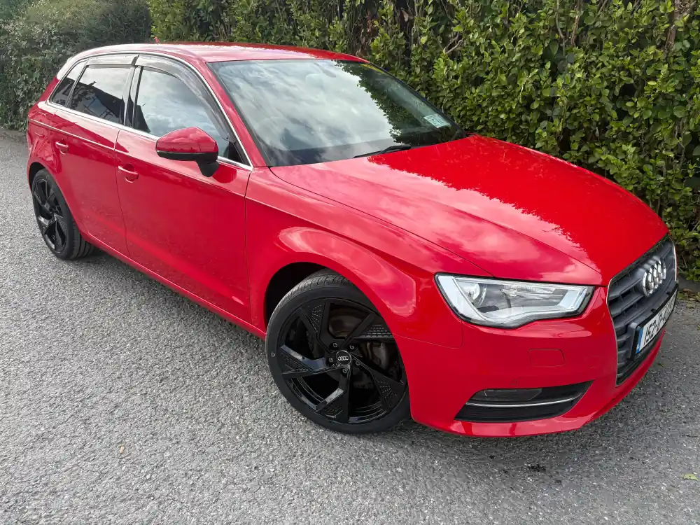 Red Audi A3 Sportback with black alloys, front three-quarter view, at RS Motors, Clonakilty